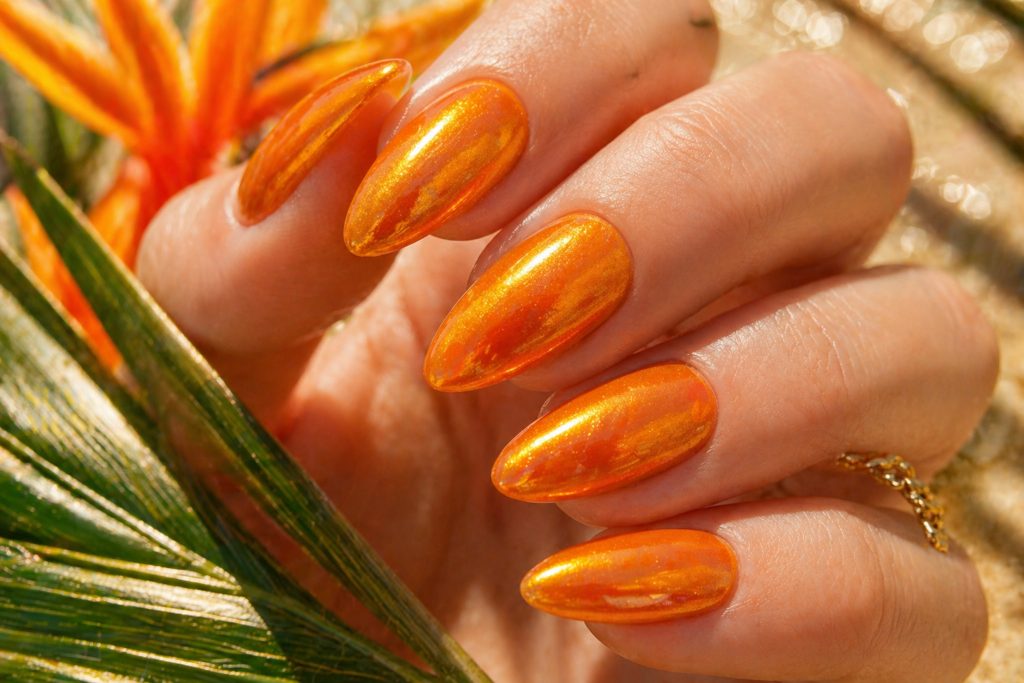  Glazed mango chrome summer nail ideas 2026 on almond-shaped nails with warm orange gold finish
