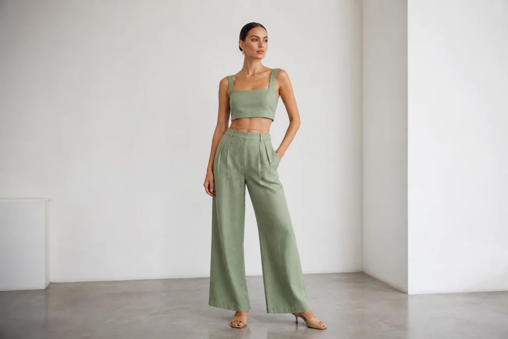 linen outfits for women 2026 — sage green linen crop top with matching high-waist wide-leg linen trousers editorial