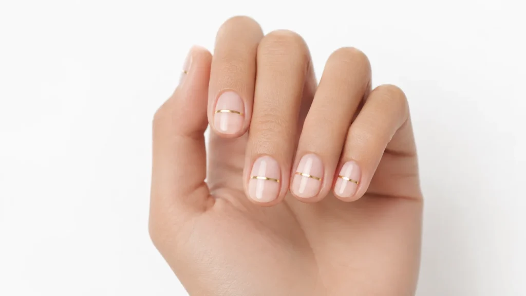 single line birthday nail art — minimalist gold line nails